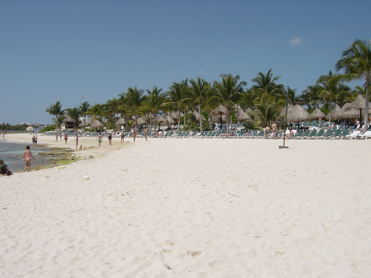 The beach in front of the Grand Mayan is sandy.  However, there are rocks off the beach, which makes swimming difficult unless you know where to go.