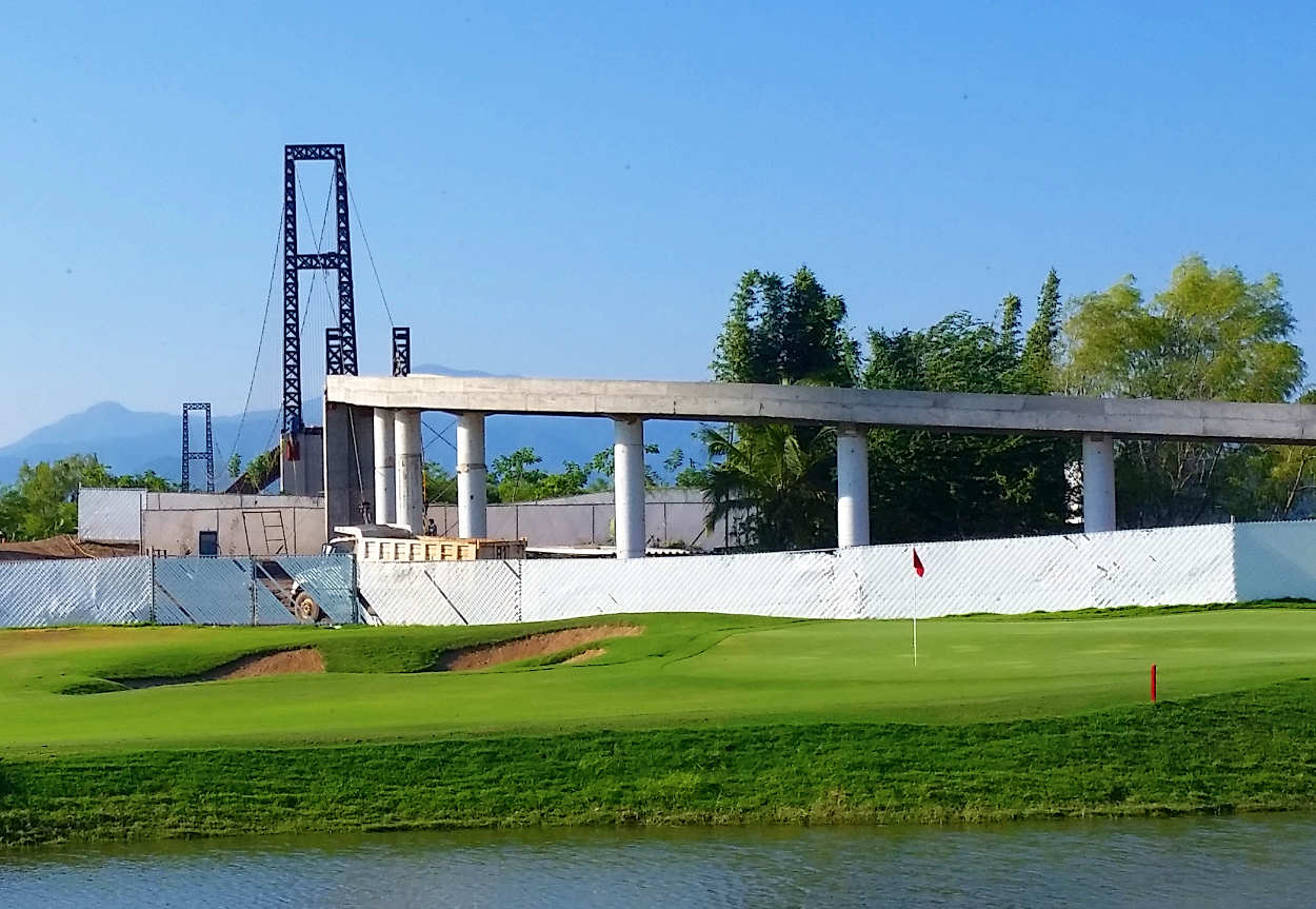 The Greg Norman course is the newest course to be opened at Grupo Vidanta's property at Neuvo Vallarta, Mexico.  Nine holes are ready to play on and nine are being seeded as of July 10, 2015.  The course is scheduled to open on December 1, 2015, and if all goes well, this will be a premium course.  Members will access the Norman course by bridge.  This photo shows the bridge under construction.