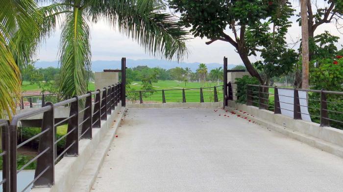 This view is on the Golf Cart Bridge looking east of Blvd. Nayarit.  The bridge is open to golf cart traffic during the day.  The gate has been locked after the last golfer finishes playing the east side.  Use caution when using this bridge to walk to restaurants near the Marina.  Taxi home at night.